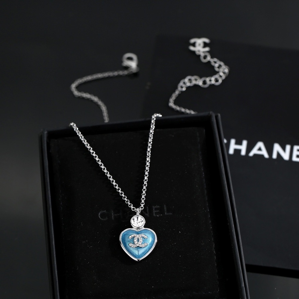 CHANEL Silver Necklace with Blue Heart Pendant
